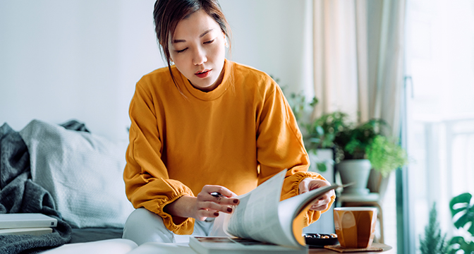 A girl turning pages in a book
